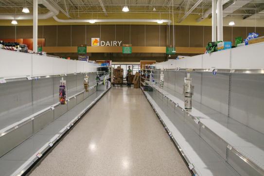 Empty shelves line grocery store walls in Orlando, Florida